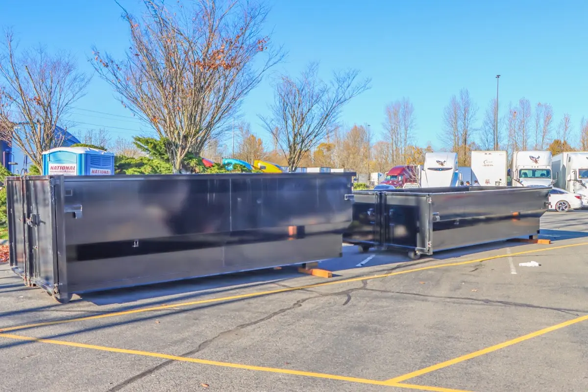 Professional dumpster rental service with roll-off container on residential driveway in Lincolnshire
